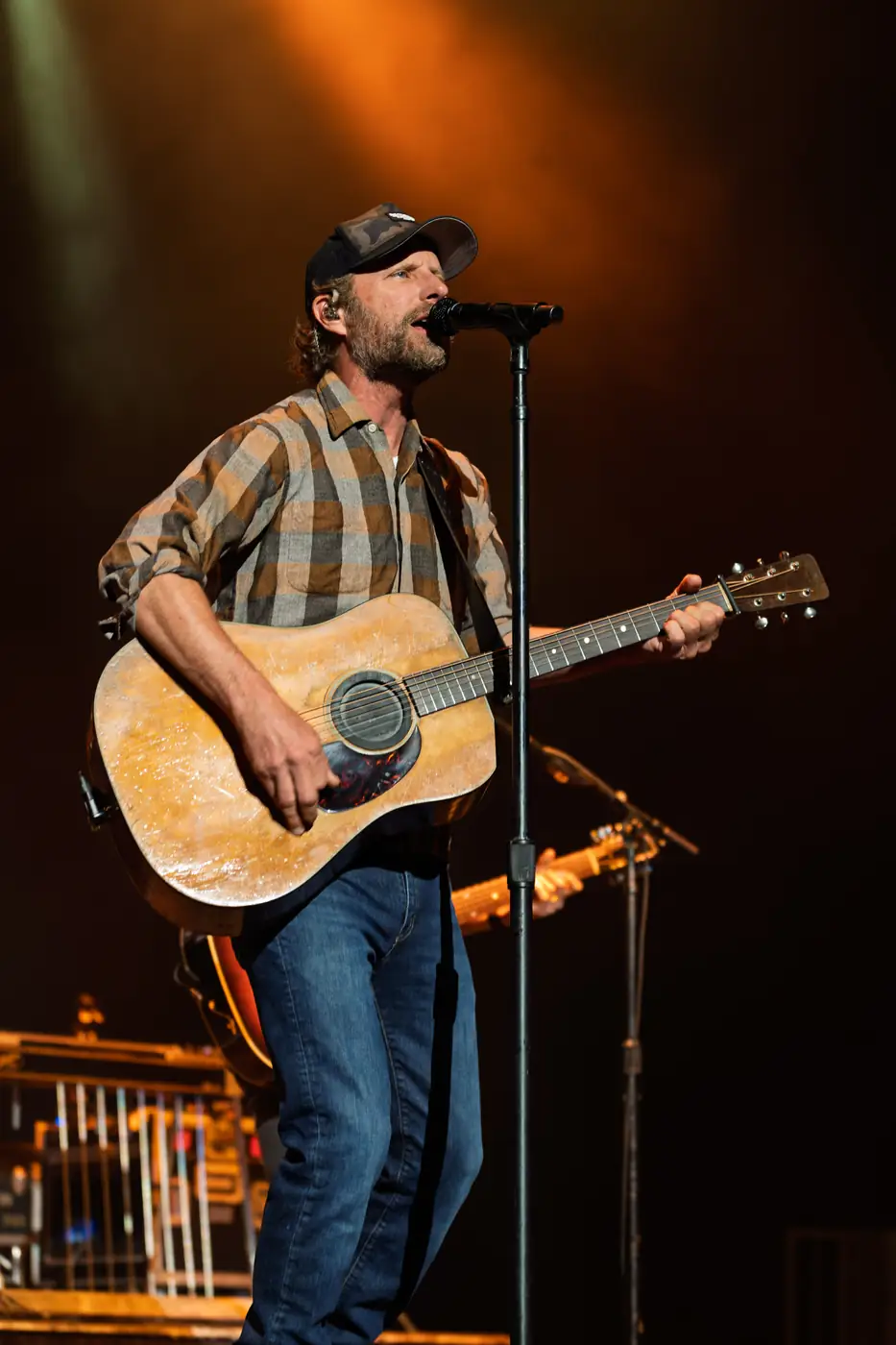Dierks Bentley on acoustic guitar in amber light